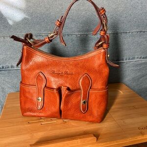 Dooney & Bourke vintage all Florentine Vacchetta Leather Bag. Collectors.
